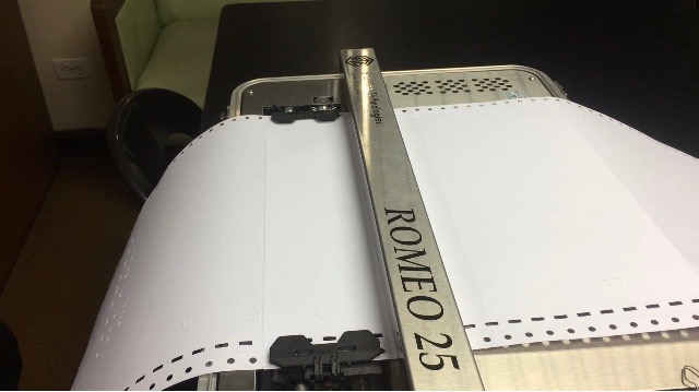 A braille material printer for visually-impaired students.