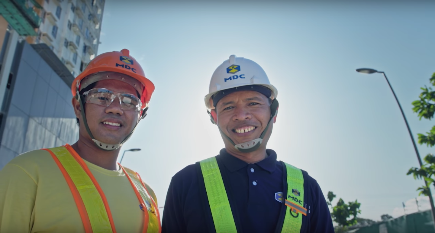 PASSING THE TORCH. Erik Villasan with his son, who is also an employee at MDC. 